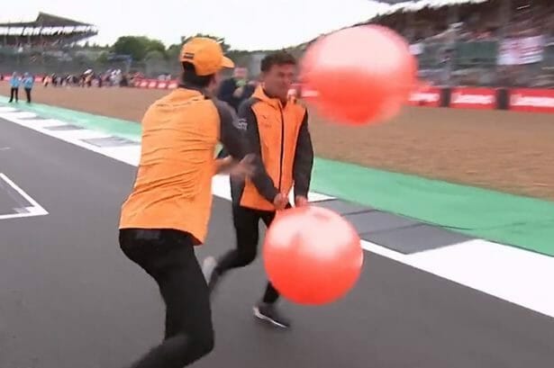 Daniel Ricciardo hitting Lando Norris with a a spacehopper.