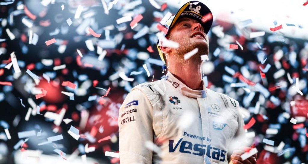 Stoffel Vandoorne celebrating his World Championship in front of a string of confetti.