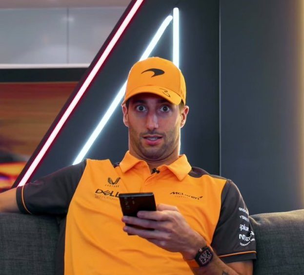 A slightly shocked Daniel Ricciardo with his phone. 