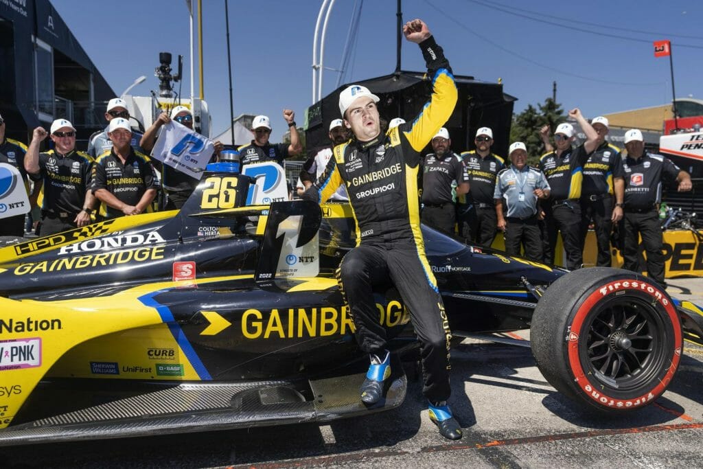 Colton Herta celebrating a P1 award with his Andretti team.