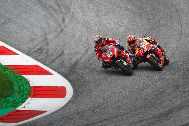 Andrea Dovizioso and MArc Marquez going into the final corner of Austria 2019.