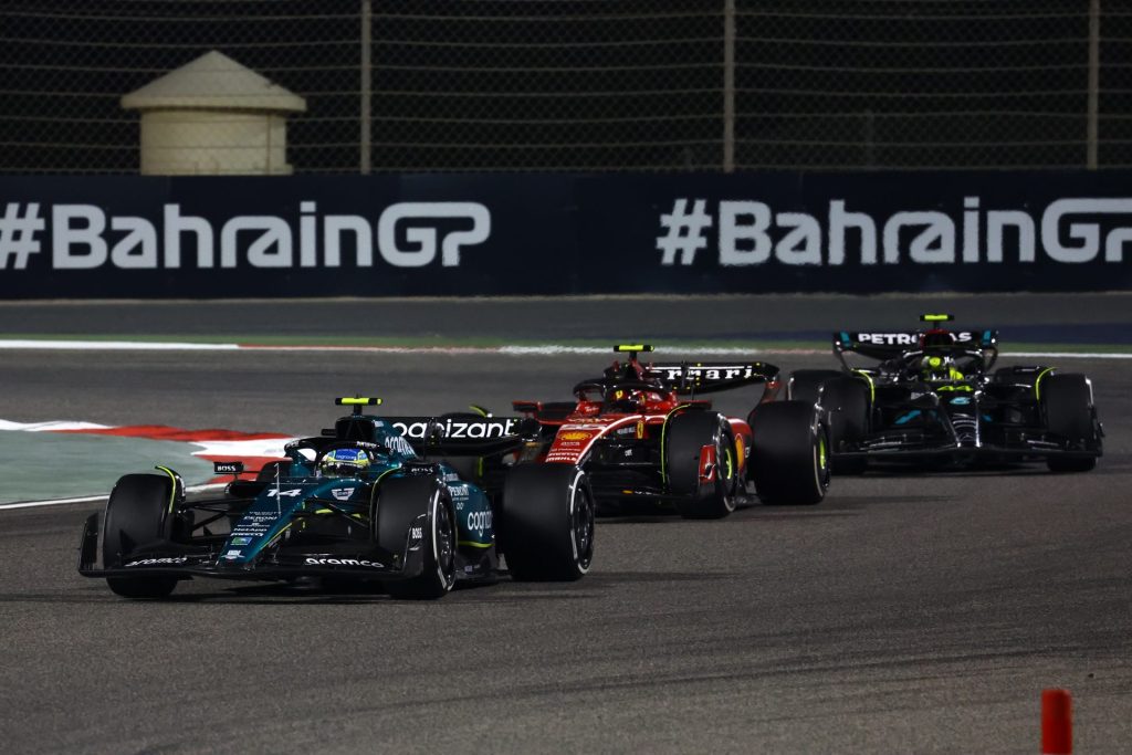 Fernando Alonso, Charles Leclerc and Lewis Hamilton on track together.